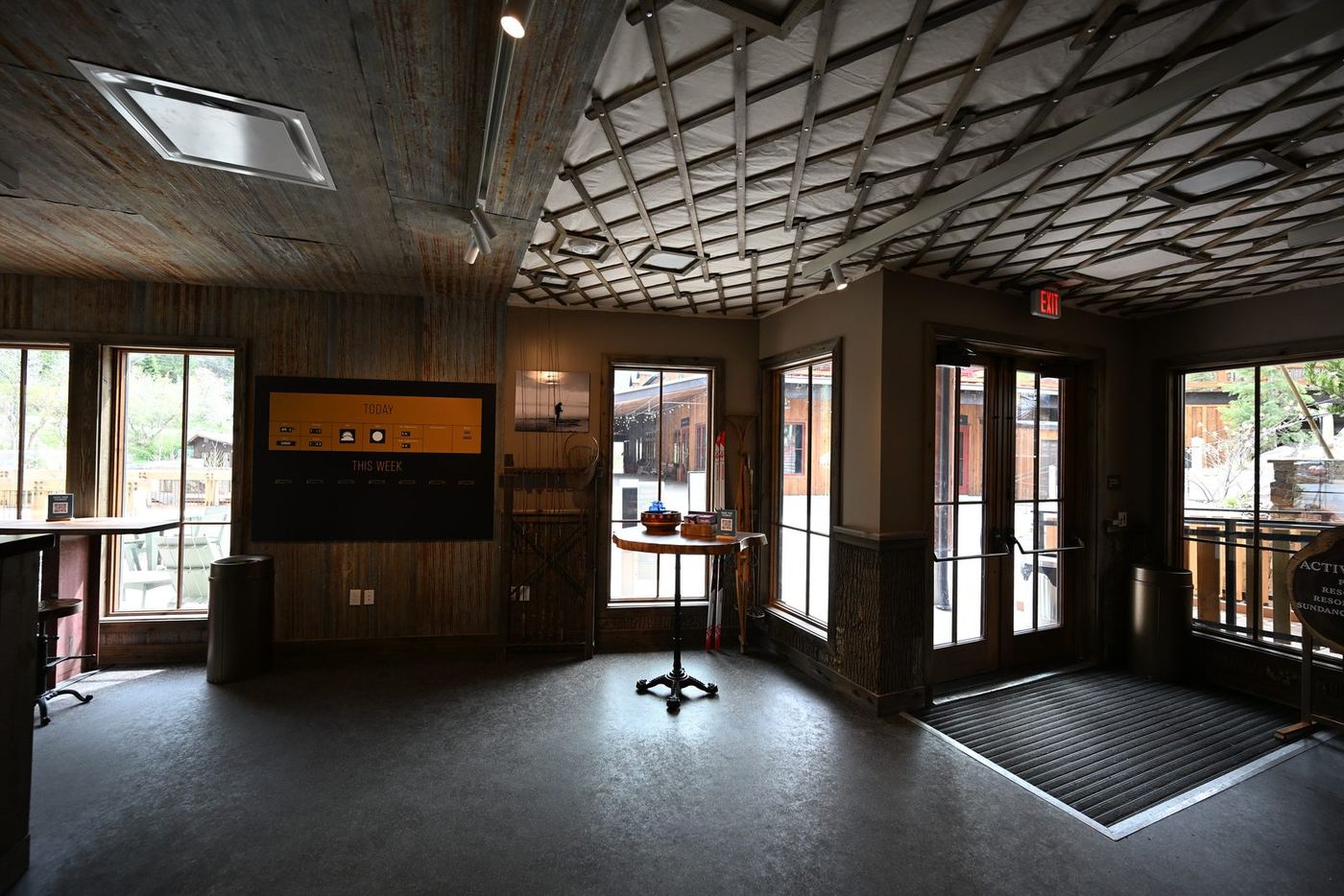 Activities center entry with wood ceiling grid and glass doors