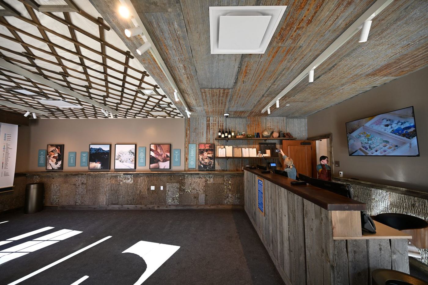 Activities center lobby with a reclaimed-wood reception desk