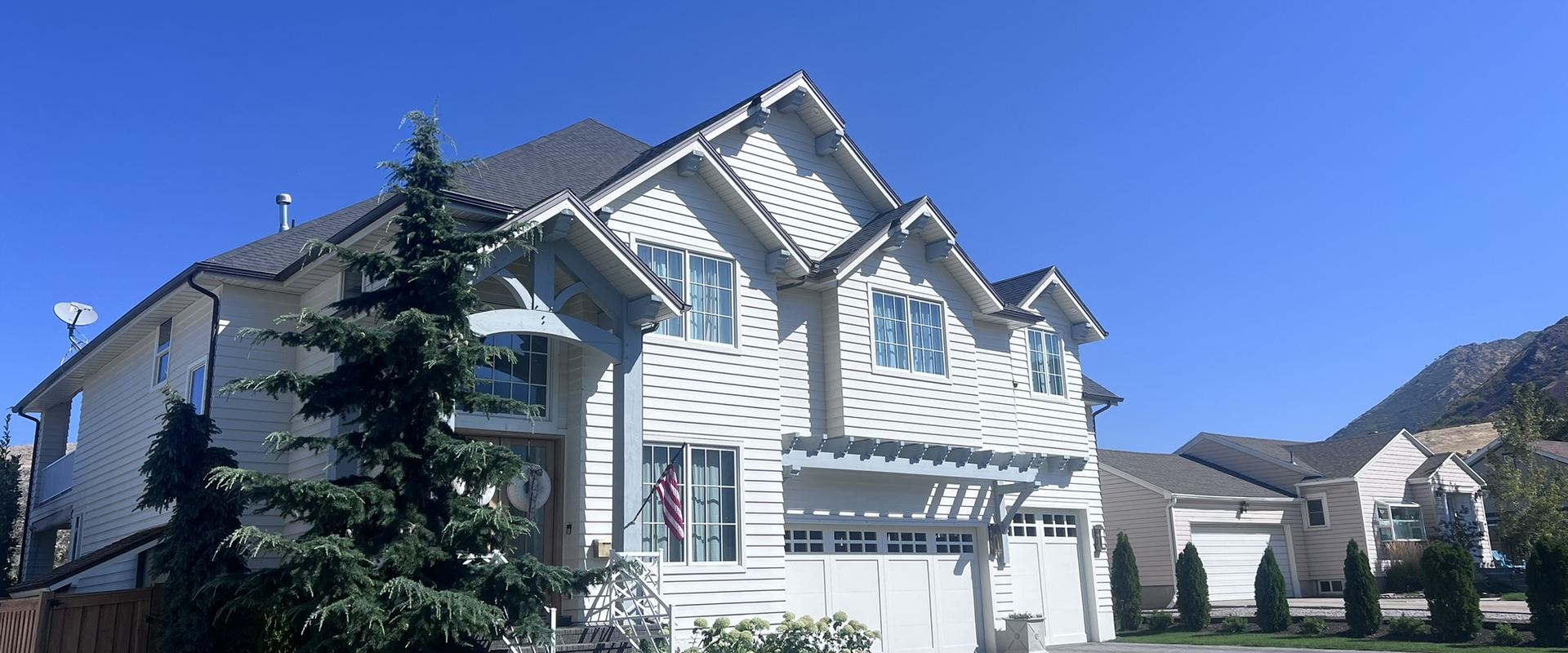 Two-story home with matching gabled dormers