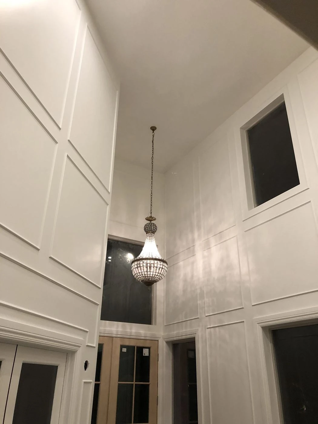 Painted coffered ceiling with a pendant light