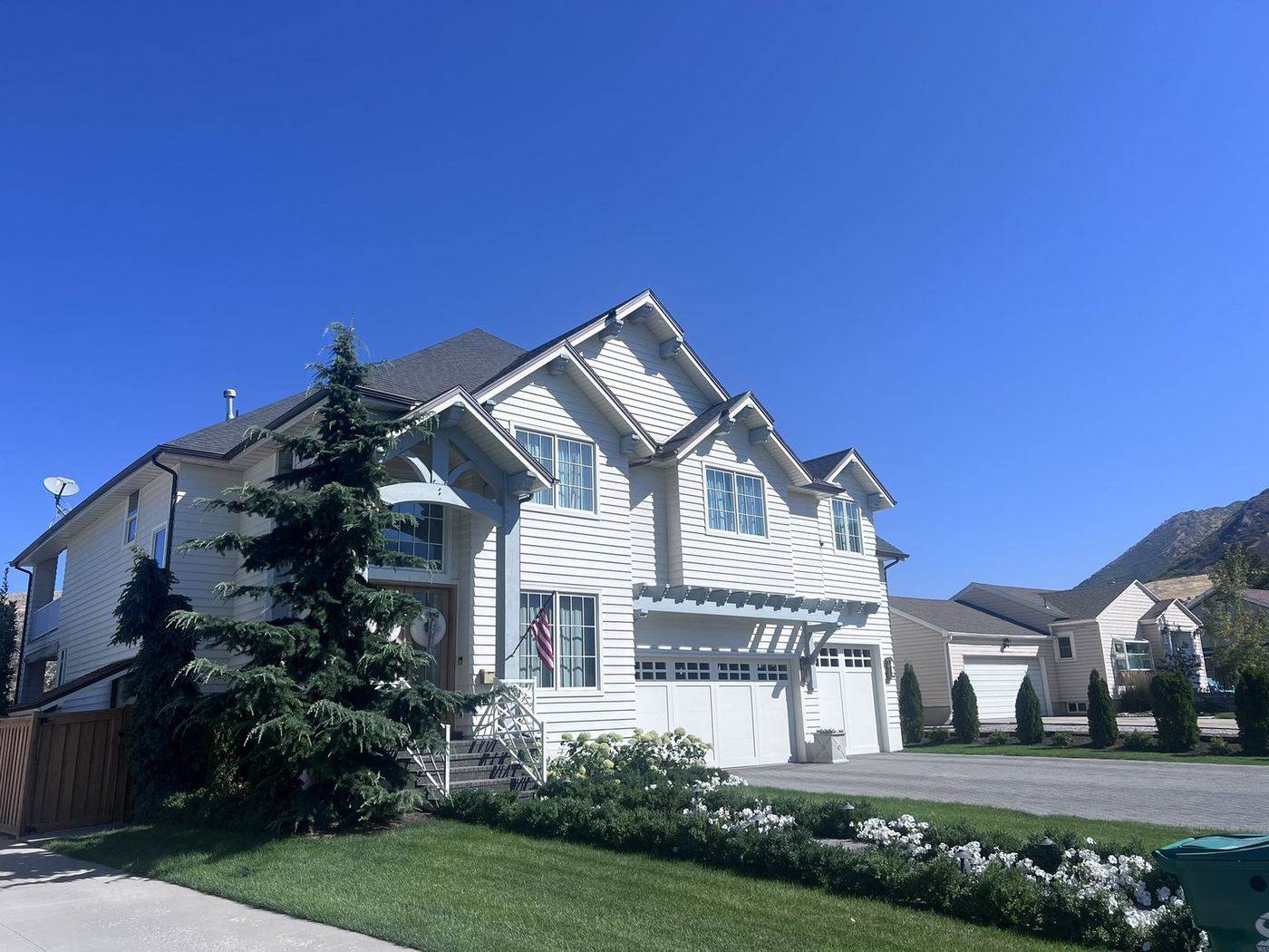 Exterior remodel with white lap siding and new windows