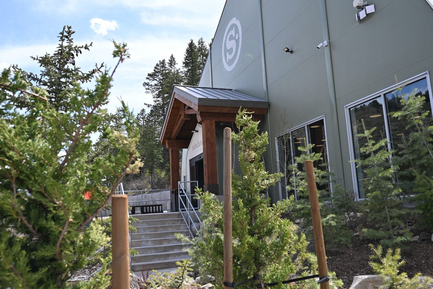 Resort lodge entry with timber stairs and railings