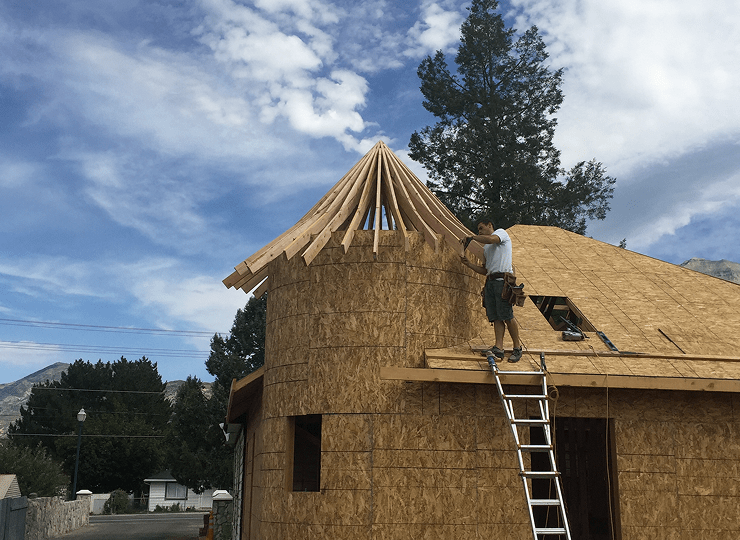 man working mid construction on a project in Utah